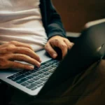Person typing on a laptop